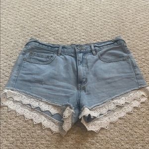 Free people denim shorts with lace detail